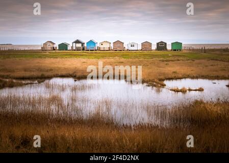 Beach huts at Seasalter beach at sunrise Stock Photo