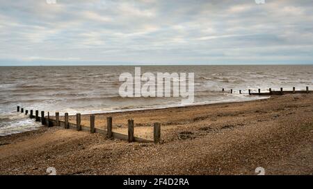 Early morning sunrise at Seasalter beach near Whitstable in Kent, England, UK. Stock Photo