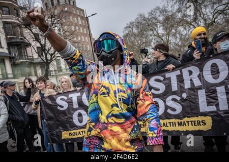 London, UK. 20th March, 2021. Coronavirus: Thousands of anti-lockdown demonstrators march under heavy police surveillance from Hyde Park to Westminster. Credit: Guy Corbishley/Alamy Live News