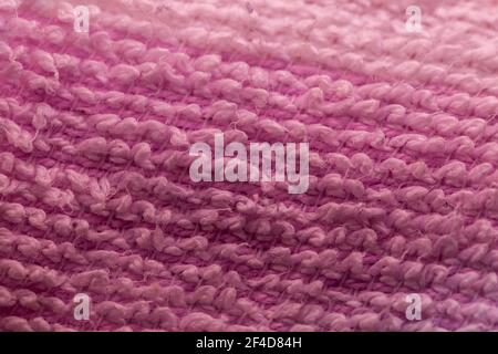 Pink Knitted Synthetic Fabric Background Stock Photo