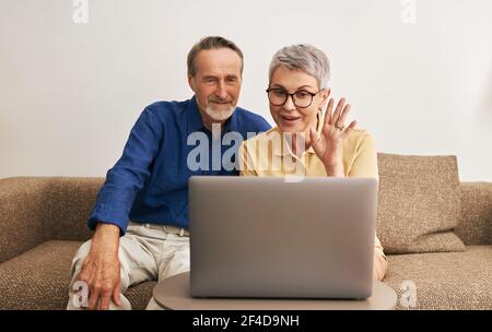 Senior couple using laptop computer Stock Photo