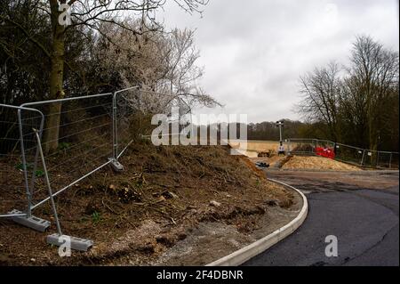 Little Amersham, Buckinghamshire, UK. 18th March, 2021. HS2 have cut an access point road through trees off the A413 as they build a haul road and prepare to construct the Little Amersham ventilation shaft. This will be one of 4 ventilation shafts into the the tunnel that they will be boring underneath the Chilterns which is an Area of Outstanding Natural Beauty. The High Speed 2 Rail link from London to Birmingham puts 108 ancient woodlands, 33 SSSIs and 693 wildlife sites at risk. Credit: Maureen McLean/Alamy Stock Photo