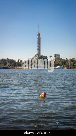 Cairo Tower and plastic polluction on the river nile in Cairo, Egypt Stock Photo