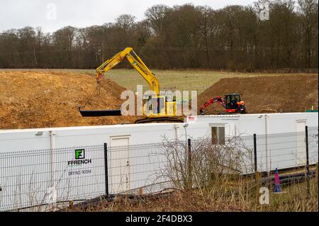 Little Amersham, Buckinghamshire, UK. 18th March, 2021. HS2 have destroyed another swathe of beautiful countryside as they build a haul road and prepare to construct the Little Amersham ventilation shaft. This will be one of 4 ventilation shafts into the the tunnel they will be boring underneath the Chilterns which is an Area of Outstanding Natural Beauty. HS2 have rerouted a public footpath around their huge construction site off the A413. The High Speed 2 Rail link from London to Birmingham puts 108 ancient woodlands, 33 SSSIs and 693 wildlife sites at risk. Credit: Maureen McLean/Alamy Stock Photo