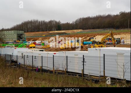 Little Amersham, Buckinghamshire, UK. 18th March, 2021. HS2 have destroyed another swathe of beautiful countryside as they build a haul road and prepare to construct the Little Amersham ventilation shaft. This will be one of 4 ventilation shafts into the the tunnel they will be boring underneath the Chilterns which is an Area of Outstanding Natural Beauty. HS2 have rerouted a public footpath around their huge construction site off the A413. The High Speed 2 Rail link from London to Birmingham puts 108 ancient woodlands, 33 SSSIs and 693 wildlife sites at risk. Credit: Maureen McLean/Alamy Stock Photo