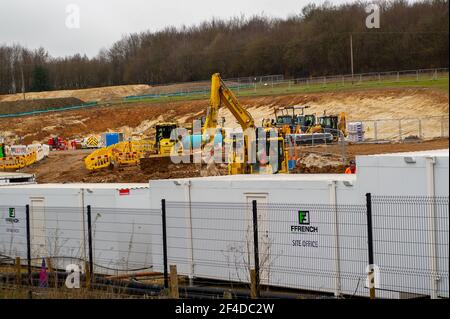 Little Amersham, Buckinghamshire, UK. 18th March, 2021. HS2 have destroyed another swathe of beautiful countryside as they build a haul road and prepare to construct the Little Amersham ventilation shaft. This will be one of 4 ventilation shafts into the the tunnel they will be boring underneath the Chilterns which is an Area of Outstanding Natural Beauty. HS2 have rerouted a public footpath around their huge construction site off the A413. The High Speed 2 Rail link from London to Birmingham puts 108 ancient woodlands, 33 SSSIs and 693 wildlife sites at risk. Credit: Maureen McLean/Alamy Stock Photo