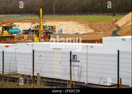 Little Amersham, Buckinghamshire, UK. 18th March, 2021. HS2 have destroyed another swathe of beautiful countryside as they build a haul road and prepare to construct the Little Amersham ventilation shaft. This will be one of 4 ventilation shafts into the the tunnel they will be boring underneath the Chilterns which is an Area of Outstanding Natural Beauty. HS2 have rerouted a public footpath around their huge construction site off the A413. The High Speed 2 Rail link from London to Birmingham puts 108 ancient woodlands, 33 SSSIs and 693 wildlife sites at risk. Credit: Maureen McLean/Alamy Stock Photo