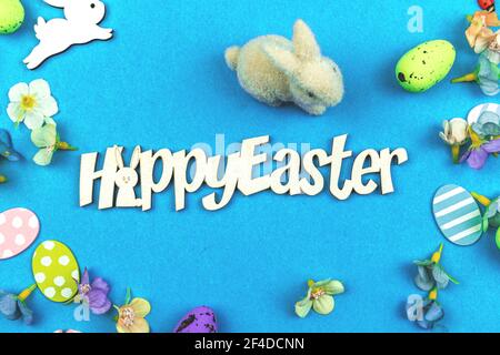 Happy Easter background with easter bunny and painted colorful eggs, top view photo Stock Photo