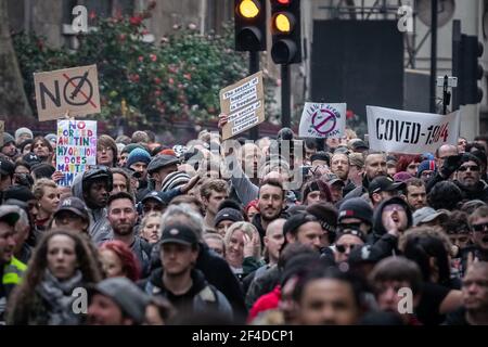 London, UK. 20th March, 2021. Coronavirus: Thousands of anti-lockdown demonstrators march under heavy police surveillance from Hyde Park to Westminster. Credit: Guy Corbishley/Alamy Live News