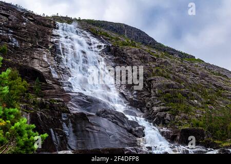 Langfossen Langfoss waterfall in summer, Etne, Norway Stock Photo