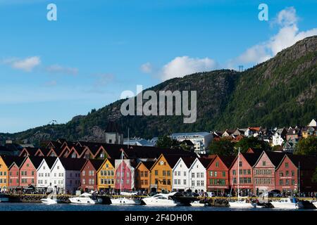 Bryggen street with wooden colored houses in Bergen during sunny summer, Norway Stock Photo