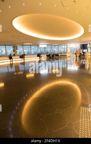 Seating area in Haneda Tokyo International Airport with reflection of ceiling lights, Japan Stock Photo