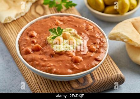 Fava beans dip. Traditional egyptian, middle eastern food foul medames with olive oil. Closeup Stock Photo