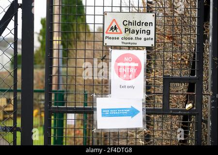 Children Playing Please Close Gate Sign at Playground Stock Photo