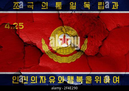 flag of Korean People's Army Ground Force painted on cracked wall Stock Photo