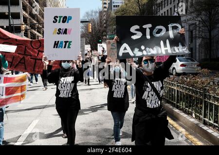 Atlanta, Georgia, USA. 20th Mar, 2021. Demonstrators holding signs that read STOP ASIAN HATE march through downtown Atlanta during a Stop Asian Hate March and Rally in Atlanta. The demonstration was held just days after the deadly shootings at three Asian operated spas in Georgia that left eight people dead, six of which were of Asian descent. The shooter, a white man named Robert Aaron Long, has been arrested and charged with eight counts of murder. Credit: John Arthur Brown/ZUMA Wire/17�Թ����� Live News Stock Photo