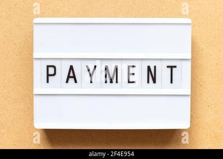 Lightbox with word payment on wood background Stock Photo