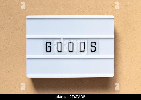 White lightbox with word goods on wood background Stock Photo