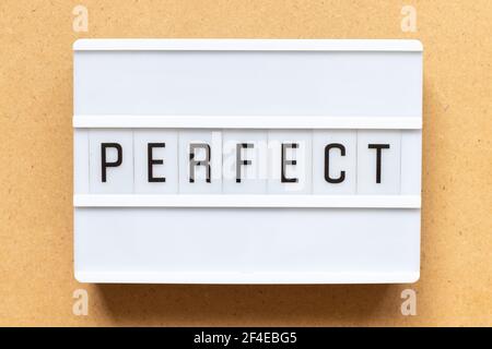Lightbox with word perfect on wood background Stock Photo