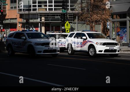 Washington, USA. 14th Mar, 2021. Metropolitan Police Department vehicles block traffic in Washington, DC, on Sunday, March 14, 2021, amid the coronavirus pandemic. (Graeme Sloan/Sipa USA) Credit: Sipa USA/Alamy Live News Stock Photo