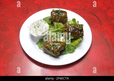 Delicious and delectable mediterranean dish known as stuffed grape leaves Stock Photo
