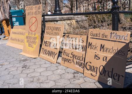 NEW YORK, NY - MARCH 20: Signs seen in Union Square at a 'Freedom Rally' in support of anti-mask and anti-vaccine on March 20, 2021 in New York City. Credit: Ron Adar/Alamy Live News Stock Photo
