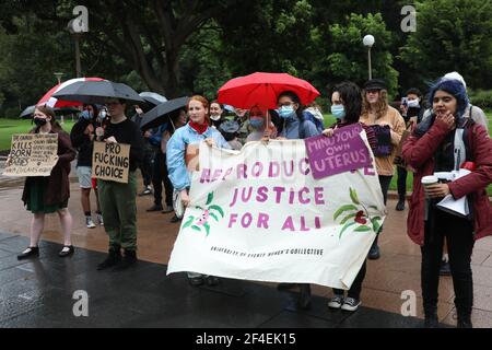 Sydney, Australia. 21st March 2021. The annual day of the unborn child procession had been cancelled the day before, however, pro-abortion counter protesters still turned up across the road from St Mary’s Cathedral to face off against a solitary church goer with sign. Pictured: counter protesters to the Catholic Church. Credit: Richard Milnes/Alamy Live News Stock Photo
