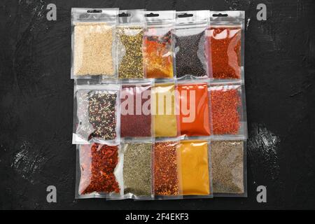 Overhead view of different spices in plastic package Stock Photo