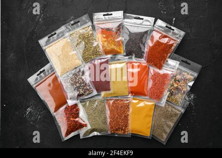 Overhead view of different spices in plastic package Stock Photo