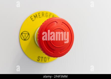 Press the emergency stop button on grey backround. Stock Photo