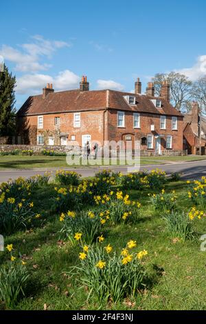 Jane Austen's House and museum in Chawton, Hampshire, England, UK, during spring with daffodils in flower Stock Photo