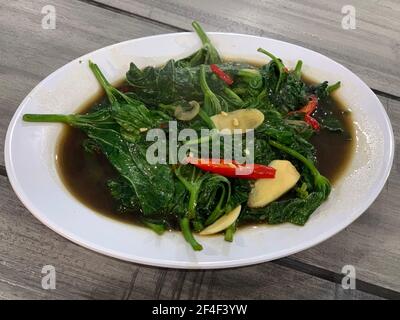 Closeup of cah kangkung, kangkong, or water spinach stirred. Stock Photo