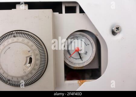 Combi boiler pressure guage at the bottom end of threshold Stock Photo