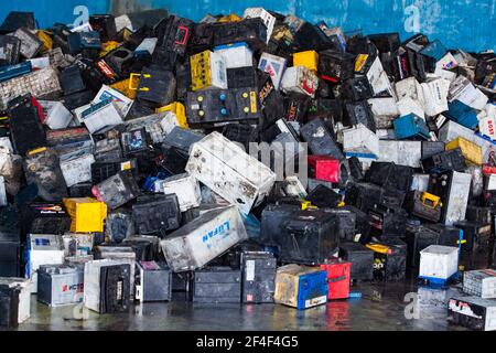 Taldykorgan, Kazakhstan - June 06 2012: Accumulator recycling plant Kainar. Used plastic boxes of batteries on warehouse ready for processing. Stock Photo