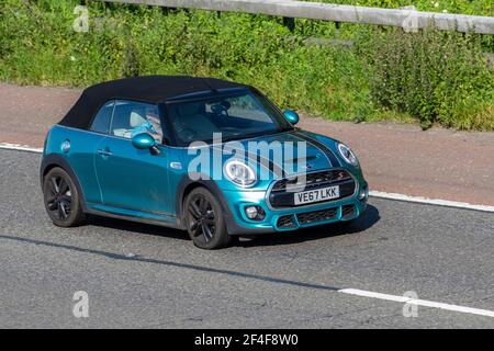 2017 (67) blue Mini Cooper S Turquoise 1998cc petrol cabriolet; Vehicular traffic, moving vehicles, cars, vehicle driving on UK roads, motors, motoring on the M6 highway English motorway road network Stock Photo