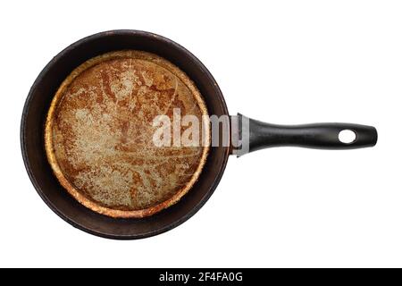 Dirty old frying pan on white background. File contains clipping path. Top view. Stock Photo
