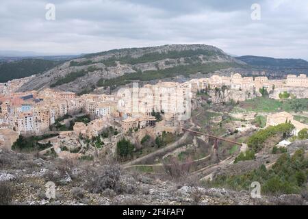 View of Hanged Houses (Casas Colgadas) and San Pablo bridge in Cuenca (Spain) taking from a hill. Stock Photo