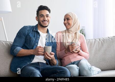 Loving muslim couple spending time together at home Stock Photo