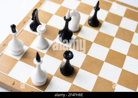 Board game chess with chess pieces in front of white background Stock Photo