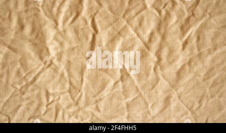 High detailed photo of old fabric. Beige canvas. Stock Photo