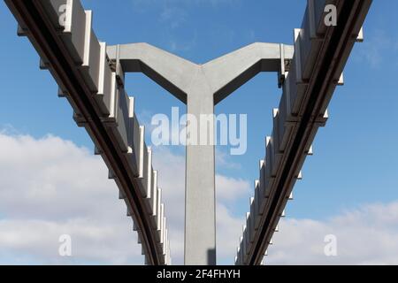 Steel and concrete monorail track against blue sky, Skytrain, Duesseldorf Airport, North Rhine-Westphalia, Germany Stock Photo