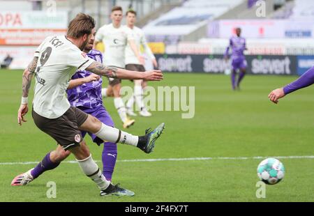 21 March 2021, Lower Saxony, Osnabrück: Football: 2. Bundesliga, VfL Osnabrück - FC St. Pauli, Matchday 26 at Stadion an der Bremer Brücke. St Pauli's Guido Burgstaller plays the ball. Photo: Friso Gentsch/dpa - IMPORTANT NOTE: In accordance with the regulations of the DFL Deutsche Fußball Liga and/or the DFB Deutscher Fußball-Bund, it is prohibited to use or have used photographs taken in the stadium and/or of the match in the form of sequence pictures and/or video-like photo series. Stock Photo