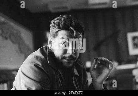 Portrait of revolutionary leader Comandante Ernesto Che Guevara, aka 'Che Guevara', in his office, Cuba, 1963. From the Deena Stryker photographs collection. () Stock Photo