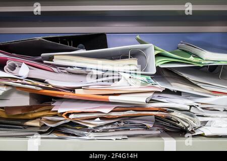 Messy file document and Office Supplies in filing cabinets at work office Stock Photo