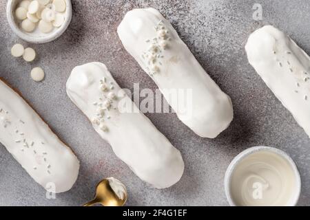 delicious eclairs with white chocolate glaze Stock Photo