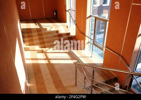 Beautiful staircase with tiled floor, great design for any purpose. Interior of the business center. Light background. Texture, background, pattern. A Stock Photo