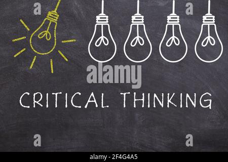 Critical Thinking, blackboard with lightbulbs Stock Photo