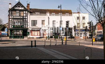Epsom London UK, March21 2021, A Traditional Irish Pub and A Row Of High Street Stores With No People