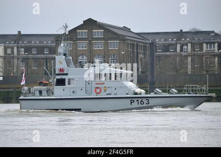 HMS Express, an Archer Class P2000 patrol boat, of the Royal Navy's Coastal Forces Squadron on the River Thames in London Stock Photo