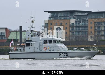 HMS Biter, an Archer Class P2000 patrol boat, of the Royal Navy's Coastal Forces Squadron on the River Thames in London Stock Photo